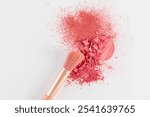 Block ,refill blush on a loose dry blush in a pink tone with a makeup brush. white background. The top view. A copy space. Care and beauty concept