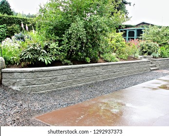 block retaining wall incorporated into existing garden landscape design   - Shutterstock ID 1292937373