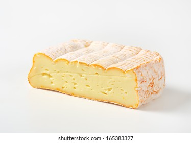 Block Of Smooth Cheese With White Mold