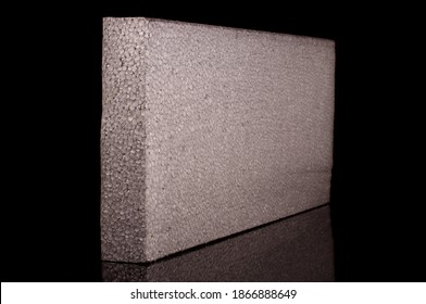 Block Of Thermal Insulation With Graphite Polystyrene For Thermal Insulation Of House Walls Isolated On The Black Background