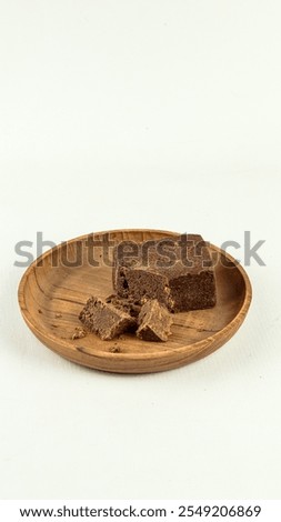A block of traditionally made shrimp paste on white background
