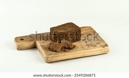 A block of traditionally made shrimp paste on white background
