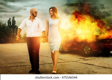 Blockbuster Picture As A Man And A Woman Go Away From Burning Car Outdoors And Looking At Each Others 