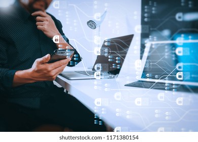 Blockchain technology concept with diagram of chain and encrypted blocks.businessman working with smart phone and digital tablet and laptop computer in modern office