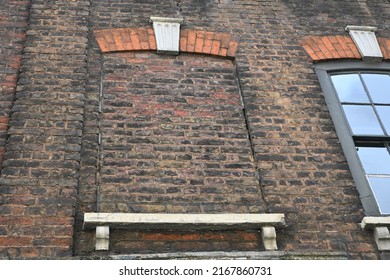 Blocked Window In Brickwork Wall Of Old Georgian Townhouse In Spitalfields District Of London, England.