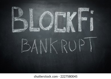 BlockFi bankrupt is written in white chalk on a black board. Close-up. BlockFi cryptocurrency exchange bankruptcy and collapse concept - Shutterstock ID 2227580045