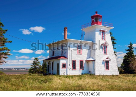 Blockhouse Point Lighthouse on Prince Edward Island and Charlottetown panorama. Prince Edward Island, Canada.