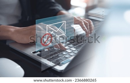 Blocking spam e-mail, warning pop-up for phishing mail, network security concept. Business woman working on laptop computer at home with warning window on screen