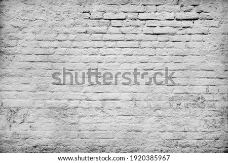 Cracking bumpy chalk stucco on aged antique dirty dusty shabby loft. Messy peeled grungy indoor rot on rustic faded stone. Worn stiff grimy decayed daub. Chipped brickwall relief blocks grunge facade Stock photo © 