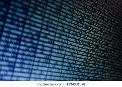blocks of binary data. Blockchain concept. blue background with computer digital binary code bit number one and zero text. selective focus on the far end of the computer display out of focus in front.
