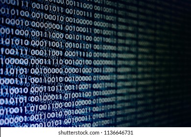 blocks of binary data. Blockchain concept. blue background with computer digital binary code bit number one and zero text. selective focus on the far end of the computer display out of focus in front.