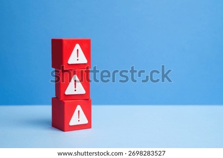 Blocks with warning signs. Danger signs. Errors and software bugs. Technological problems. Cybersecurity, industrial safety, and IT malfunction topics.