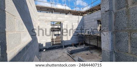 Blockwork walls under construction on building site 