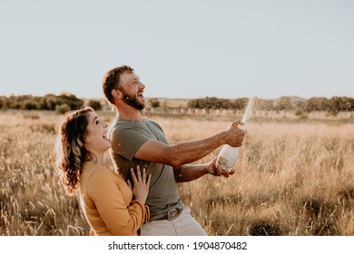 Bloemfontein, South Africa November 28, 2020: Engaged Couple Celebrating Their Engagement With Popping Champagne And Celebrating At Sunset 