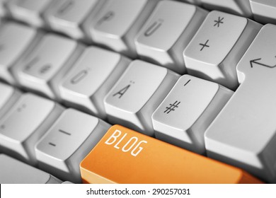 Blog Business Concept -Orange Button Or Key On White Keyboard