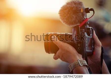 Blogger content creator camera handheld shooting video footage