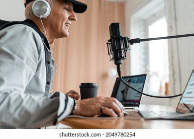 A Blogger On The Radio Communicates With Listeners. A Journalist And A Laptop. The Radio Host Transmits Good News. The Speaker Speaks Into The Microphone. Live Broadcast Recording Of The Podcast Show.