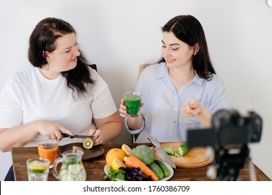 Bloggers Collaboration. Nutritionist Blogger Recording New Video With Overweight Guest. Dietary Blog, Healthy Cooking, Online Channel.