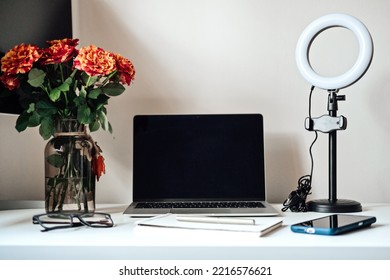 Blogging Equipment. How To Start Blog, Blogging For Beginners. Laptop, Mobile Phone, Ring Light, Notebook And Glasses On The Table