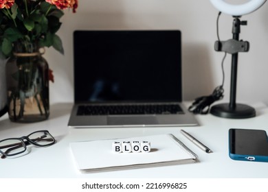 Blogging Equipment. How To Start Blog, Blogging For Beginners. Laptop, Mobile Phone, Ring Light, Notebook And Glasses On The Table