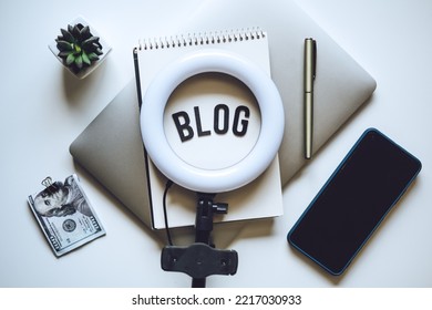 Blogging Equipment. How To Start Blog, Blogging For Beginners. Laptop, Mobile Phone, Ring Light, Notebook And Glasses On The Table