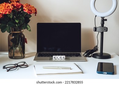 Blogging Equipment. How To Start Blog, Blogging For Beginners. Laptop, Mobile Phone, Ring Light, Notebook And Glasses On The Table