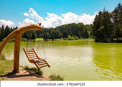 Bloke lake - Blosko jezero in the morning, wooden swing, volcje jezero, Nova Vas, Slovenia - Shutterstock ID 1781669123
