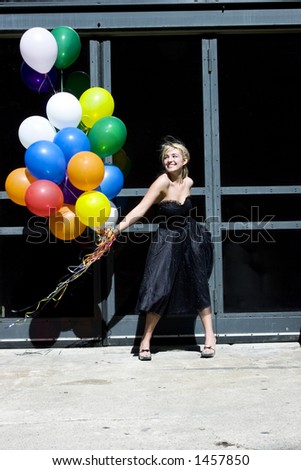 Blond with balloons out in the sun