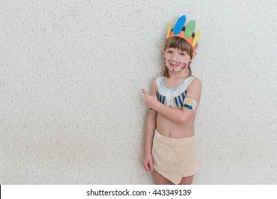 Blond Boy Playing Native American. Child Painted Face Paint