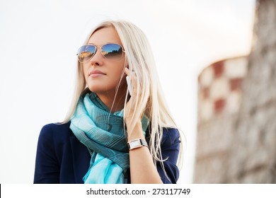 Blond Fashion Business Woman In Blue Blazer And Scarf Calling On Cell Phone Outdoor