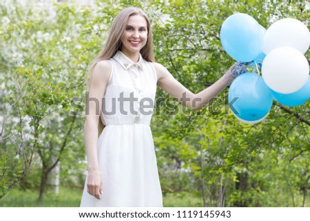 Blond girl with balloons