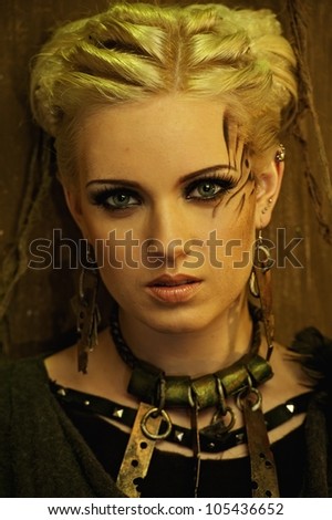 Blond girl with a ethnic necklace portrait