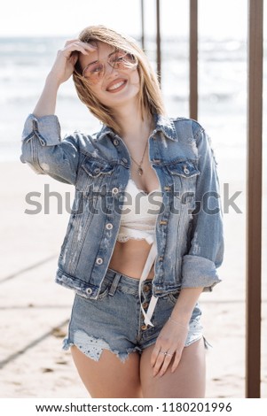 Similar – Young woman sits at the Baltic Sea beach