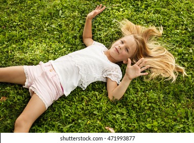 Similar Images, Stock Photos & Vectors of Blond girl is lying down on ...