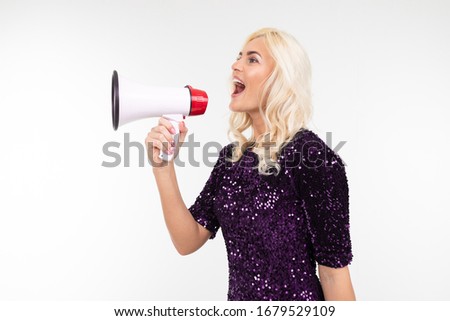 blond girl with a megaphone presents news on a white background with copy space