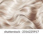 Blond hair close-up as a background. Women