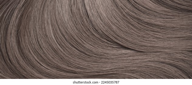 Blond hair close-up as a background. Women's long light brown hair. Beautifully styled wavy shiny curls. Hair coloring. Hairdressing procedures, extension. - Shutterstock ID 2245035787