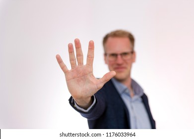 Blond Handsome Happy Man Is Showing Hand And His Five Fingers

