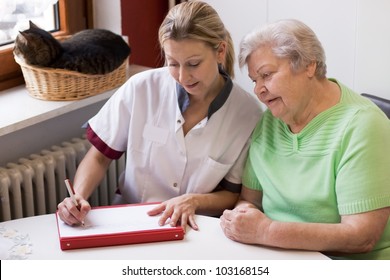 blond nurse visiting a senior patient at home