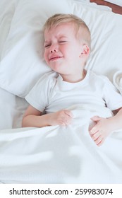 Blond Toddler Boy Crying In Bed 