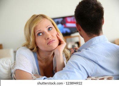 Blond Woman Being Bored Watching Tv Ith Boyfriend