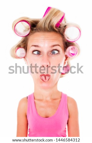 blond woman with big head and curlers making a funny face