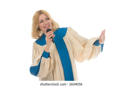 Blond Woman In A Choir Robe Holding A Microphone And Singing.