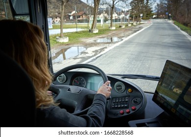 Blond Woman Driving A Bus