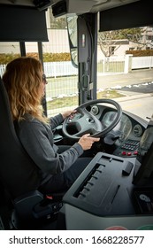 Blond Woman Driving A Bus