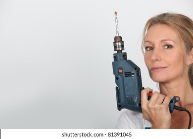 Blond Woman Holding Electric Drill