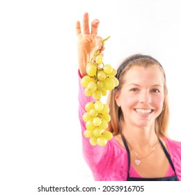 Blond Woman Holding Ripe Grapes, White Background