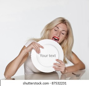 Blond Woman Licking Plate. Copy Space