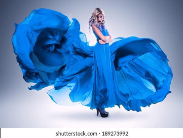 Blond Woman In Long Beautiful Blue Dress