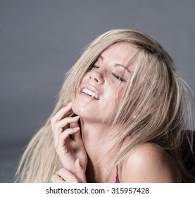 Blond Woman With Look Of Ecstasy On Face